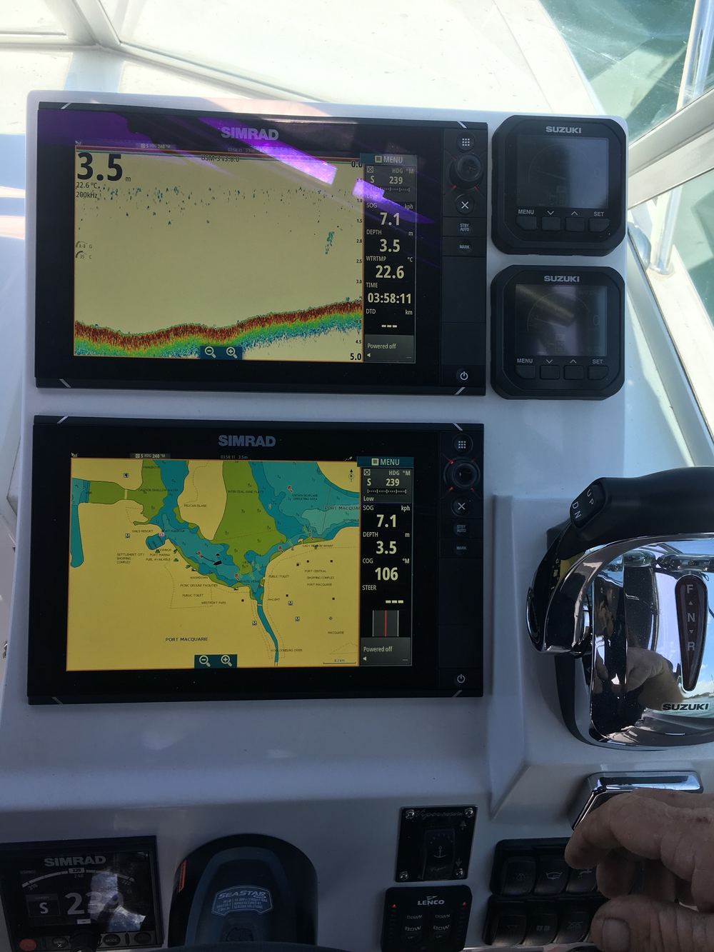 Simrad multifunction displays and Suzuki outboard controls fitted at helm by Shotgun Marine Services Port Macquarie NSW